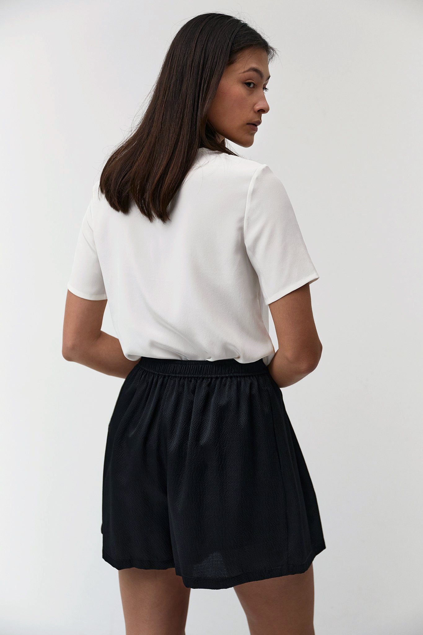 The Array womenswear fashion label london fashion brand workwear womens fashion  Pleated Shorts in Black Hammered Silk